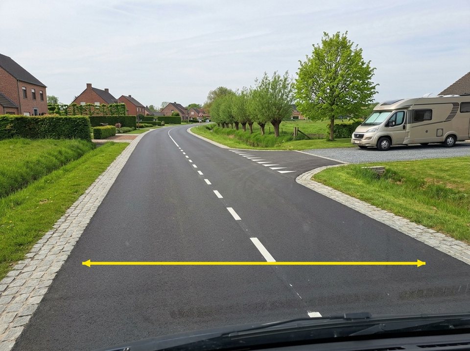 The yellow arrow indicates the carriageway, the hardened surface of the public road designed for vehicular traffic.